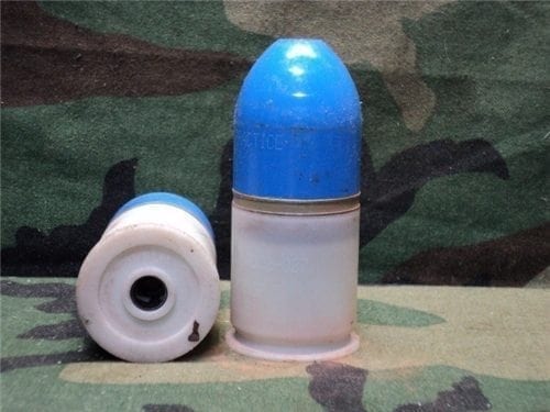 M79/203 Inert plastic case dummy round with blue plastic projectile.
